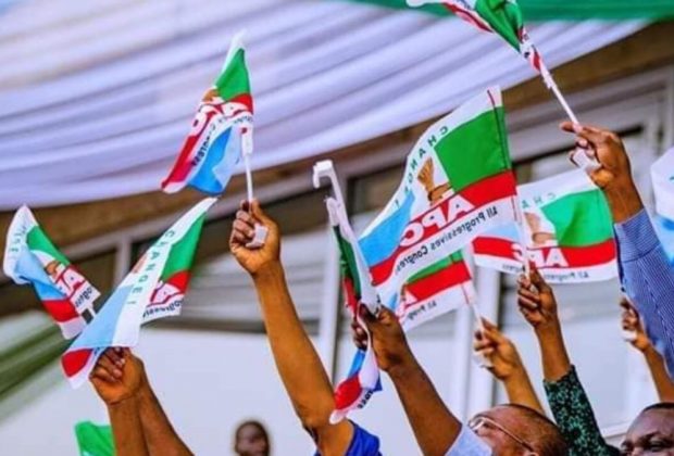 apc members holding party flag 1200x675 1