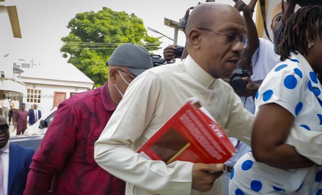 godwin emefiele arrived court with bible 1